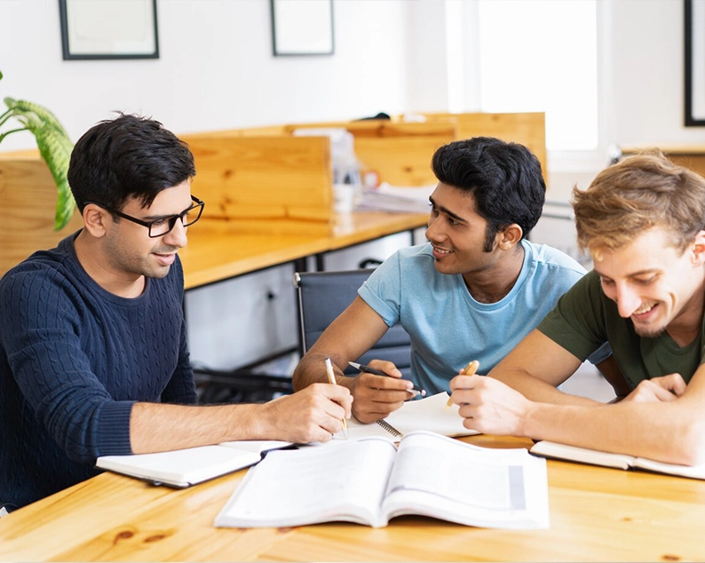 Group of students studying together at library for Abroad Study Consultancy Kerala